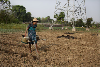 Opens popup gallery with A  farms her land in the village of Dwar Ther Hle, Myanmar. 
