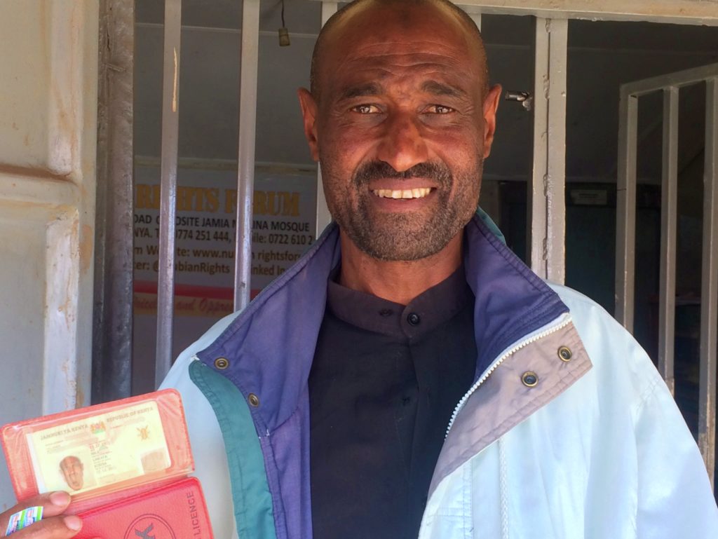 Mahmoud proudly displays his new identity card.