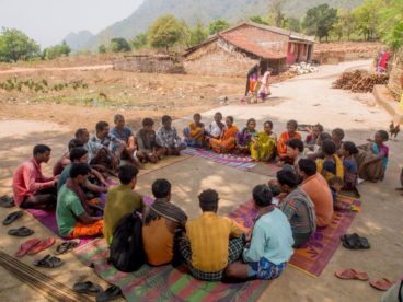 Opens popup gallery with Villagers gather for a legal awareness meeting